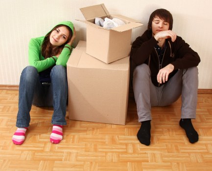 Apartment moving team carrying furniture through a Paddington building