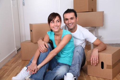 Trained movers handling boxes and equipment safely