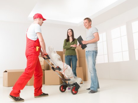 Professional movers loading office items for transport in Paddington