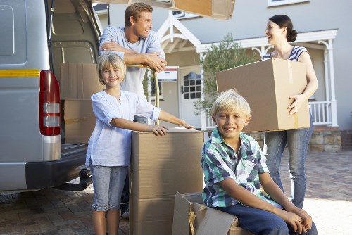 Movers protecting wooden furniture during a Paddington home move