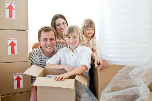 Professional movers loading boxes for urgent relocation