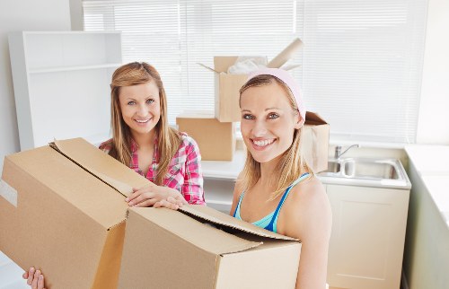 Movers handling furniture during a Paddington flat relocation